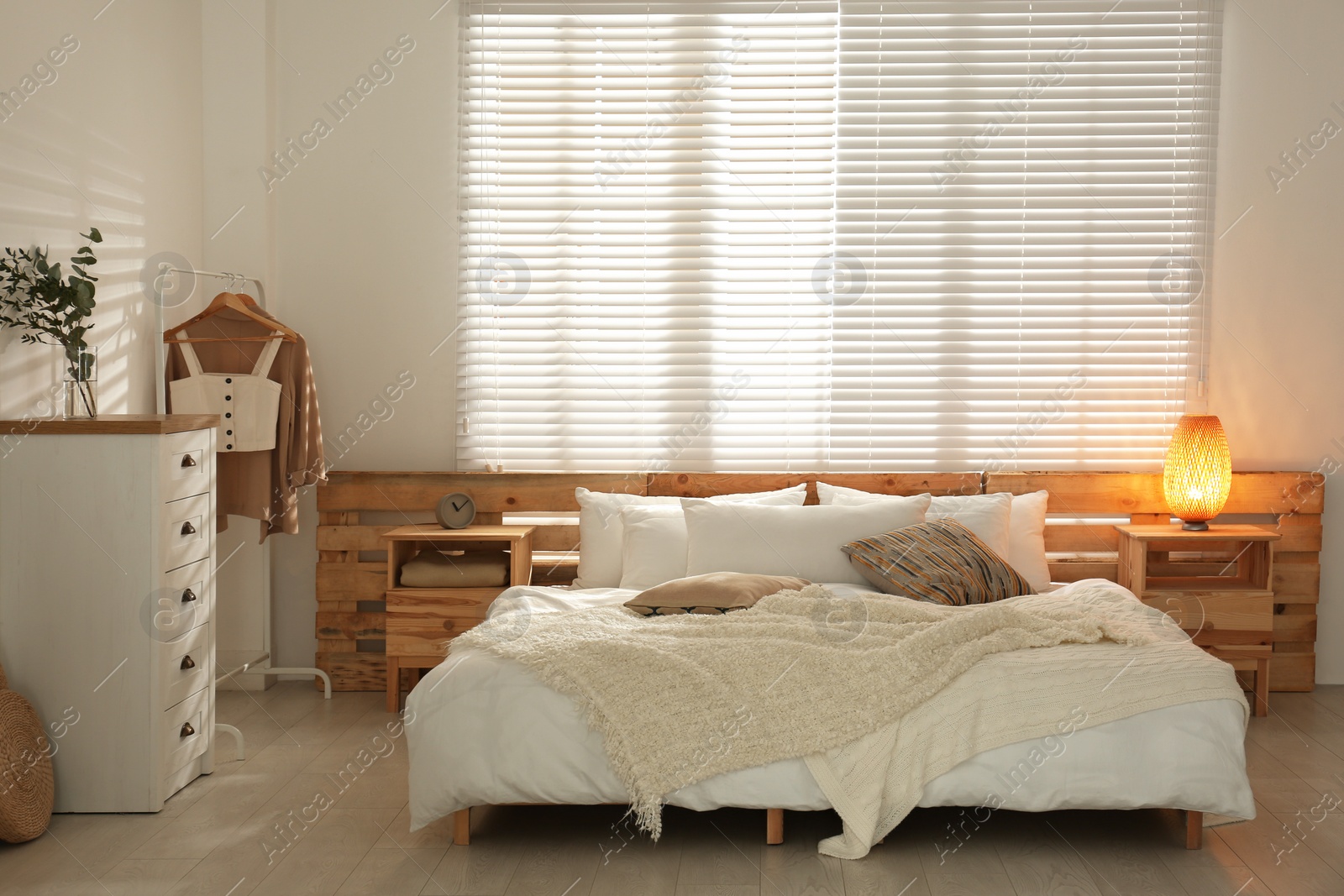 Photo of Stylish bedroom with modern chest of drawers