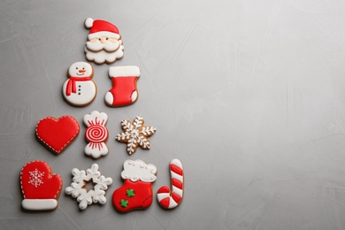 Christmas tree shape made of delicious gingerbread cookies on light table, flat lay. Space for text