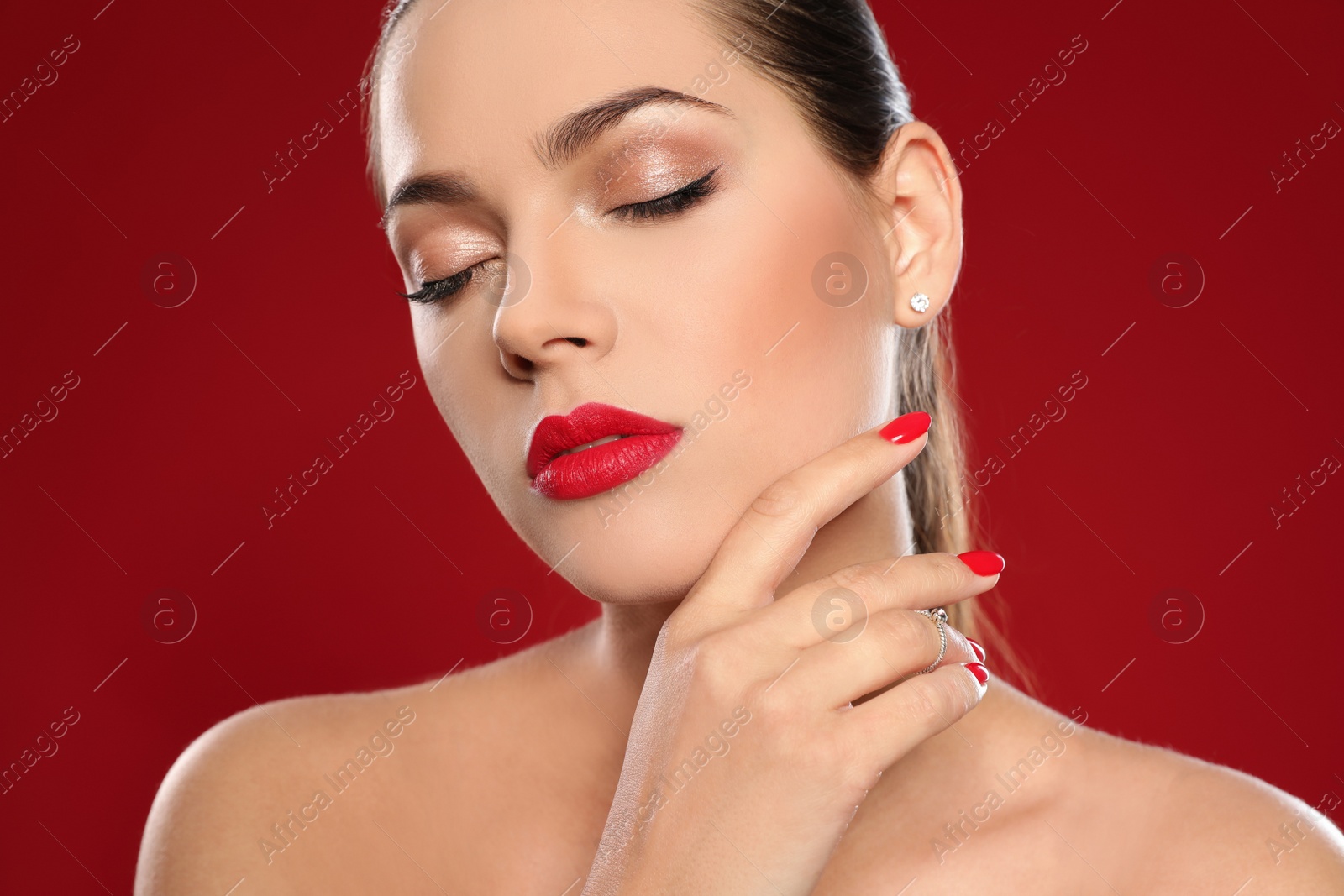 Photo of Beautiful young woman with bright manicure on color background, closeup. Nail polish trends