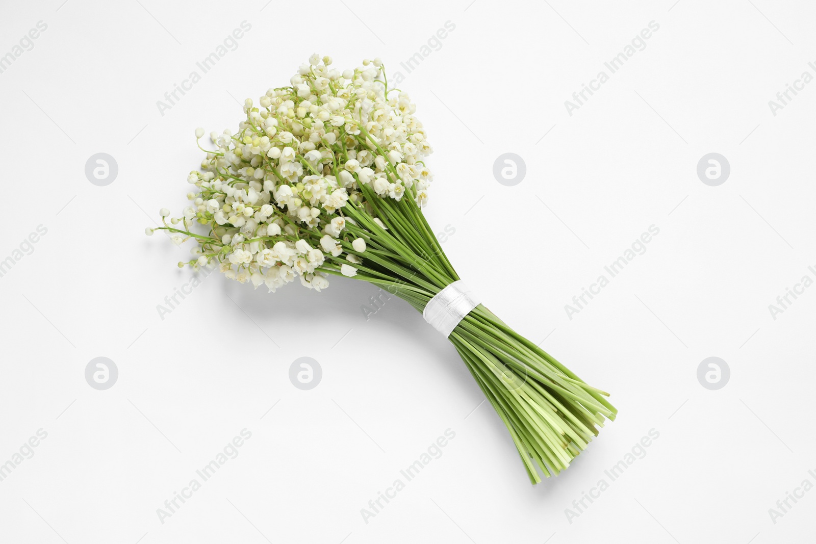 Photo of Beautiful lily of the valley bouquet on white background, top view