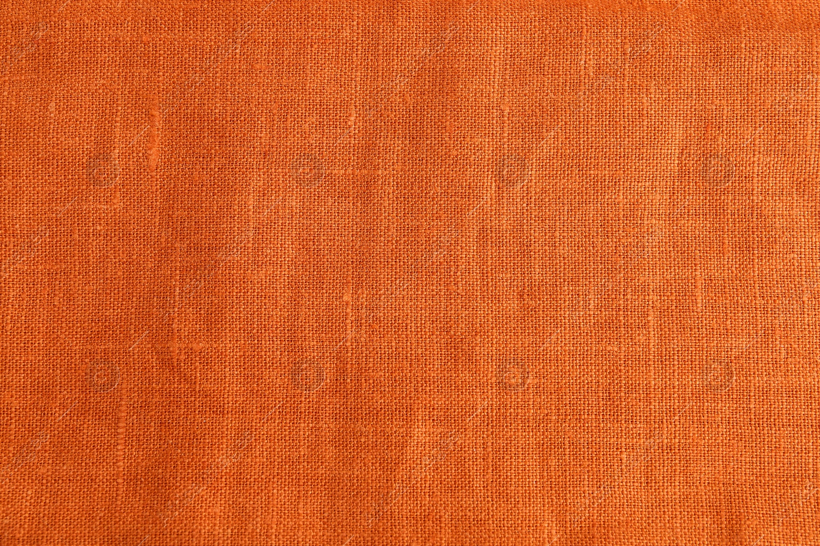 Photo of Texture of beautiful orange fabric as background, closeup