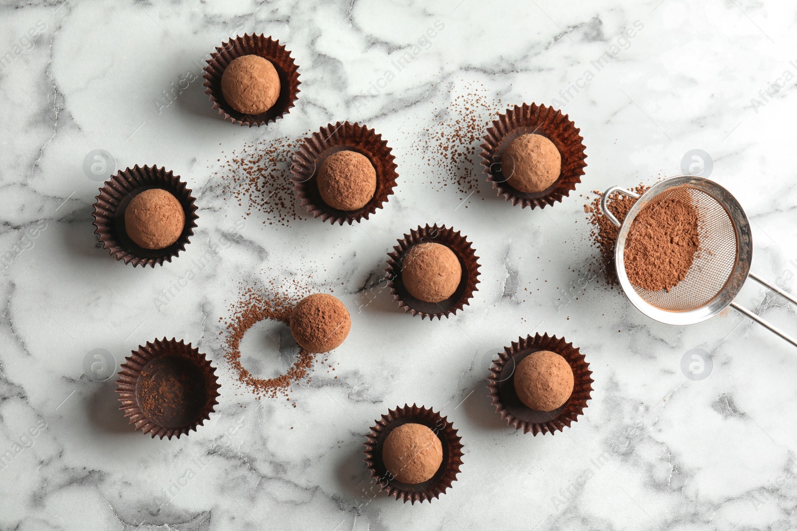 Photo of Flat lay composition with tasty raw chocolate truffles on marble background