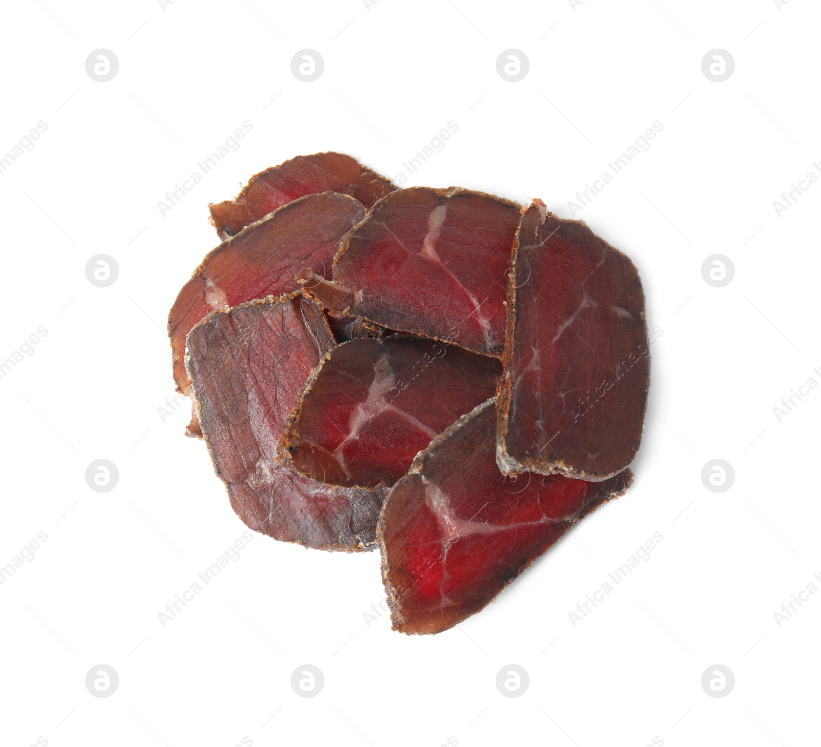 Photo of Delicious dry-cured beef basturma slices on white background, top view