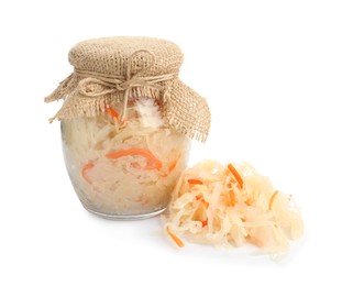 Photo of Glass jar of tasty fermented cabbage with carrot on white background