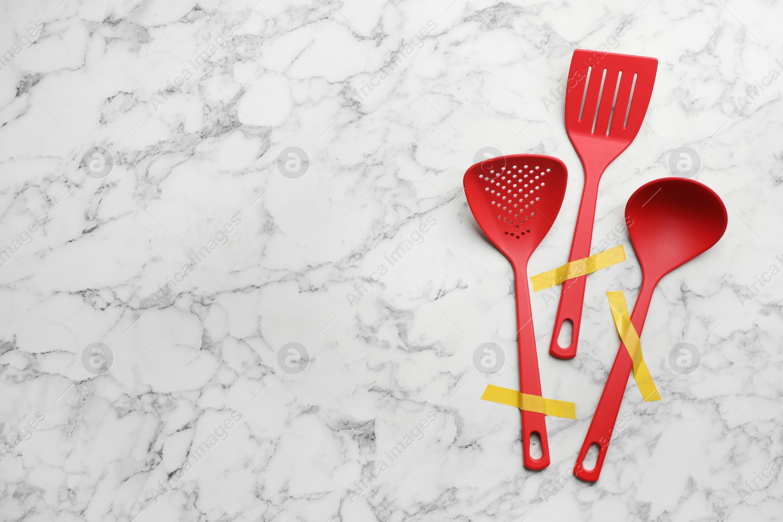 Photo of Different clean kitchen utensils on marble background, flat lay. Space for text