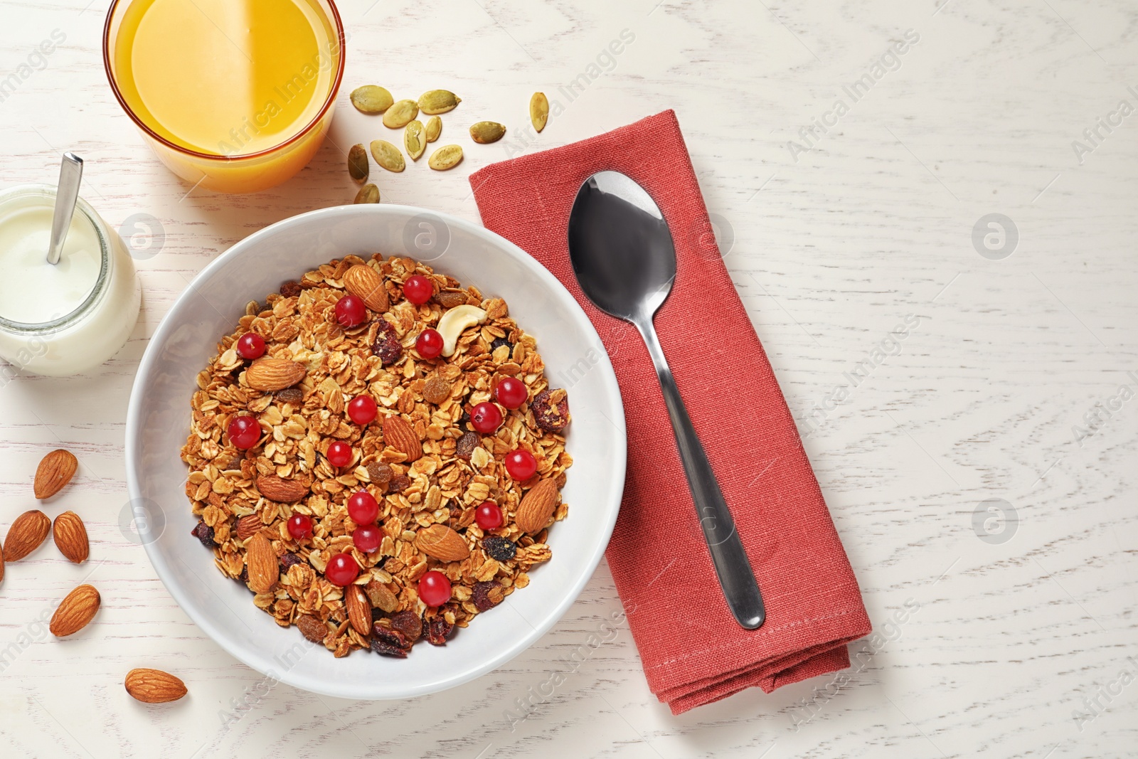 Photo of Tasty healthy breakfast served on white wooden table, flat lay