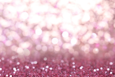 Blurred view of pink glitter as abstract background, bokeh effect