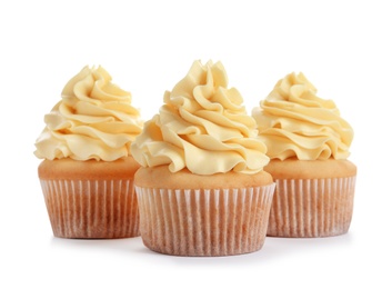 Delicious cupcakes with cream on white background