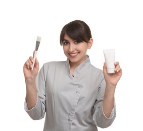 Cosmetologist with cosmetic product and brush on white background