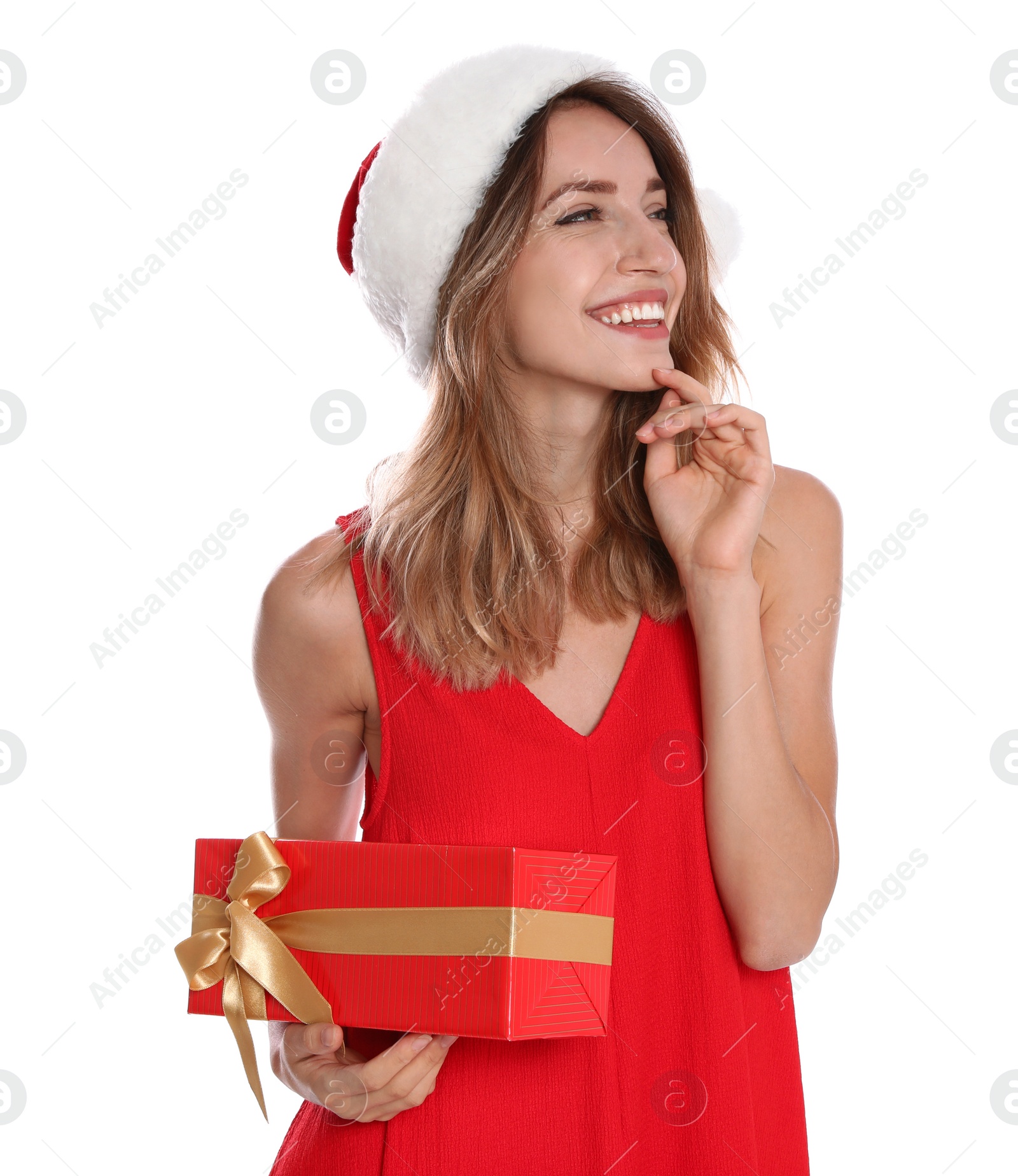 Photo of Happy young woman in Santa hat with gift box on white background. Christmas celebration