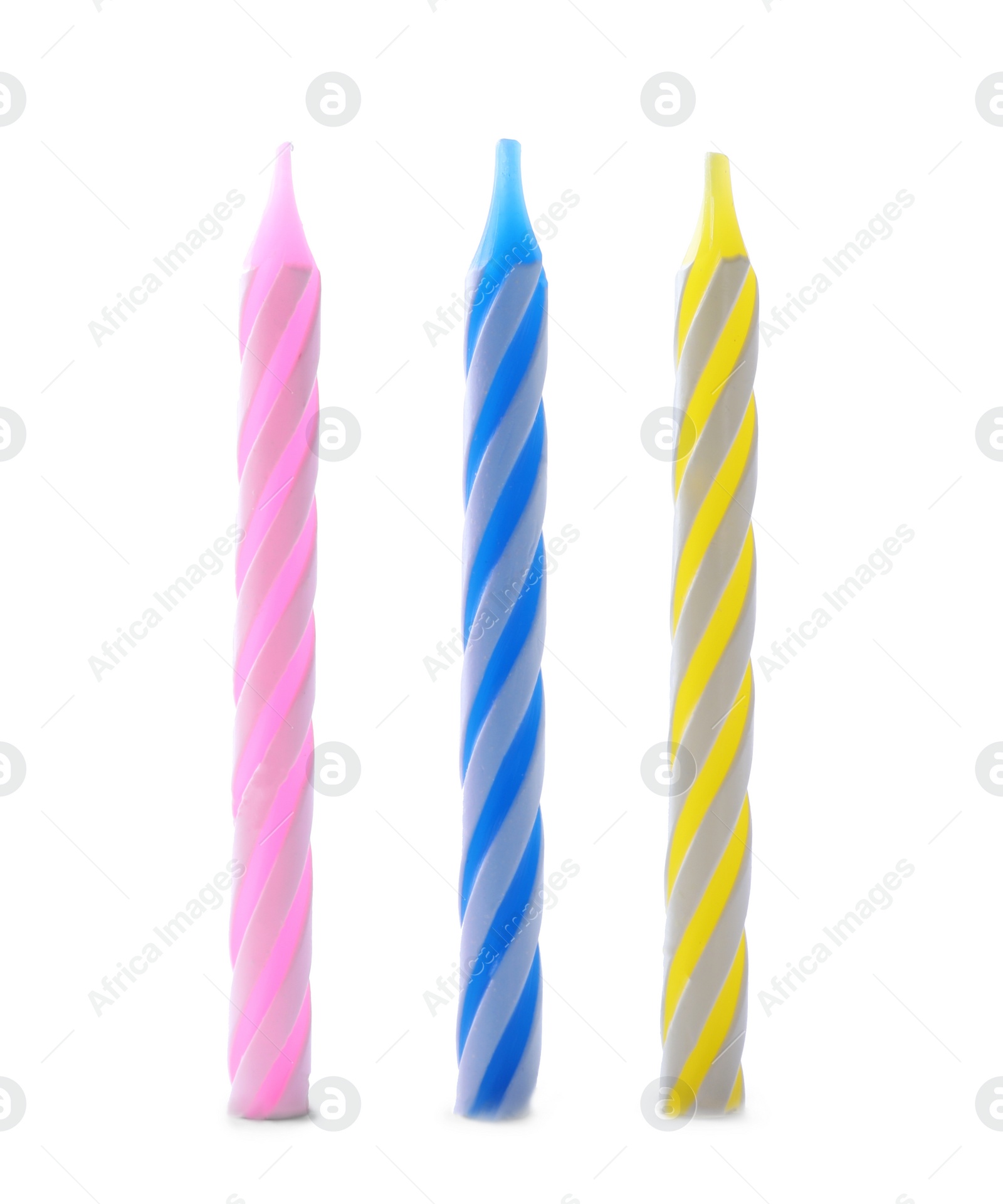 Photo of Set of colorful striped birthday candles isolated on white