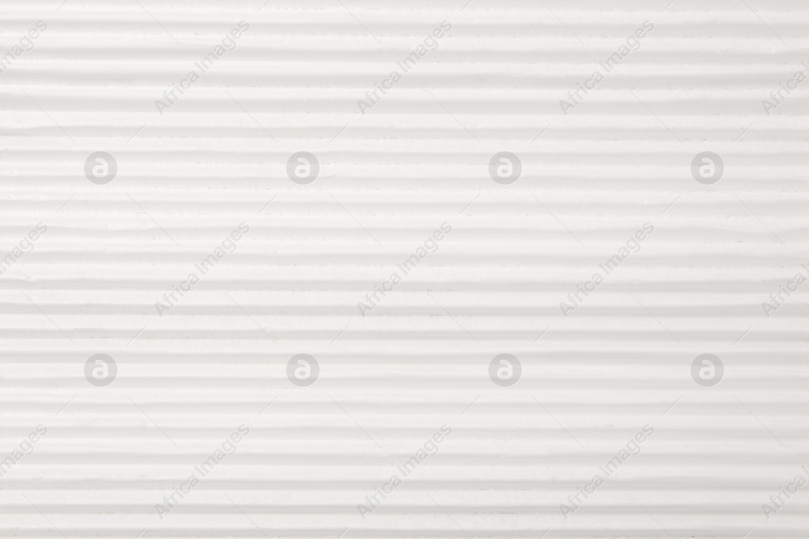 Photo of Texture of white paper sheet as background, closeup