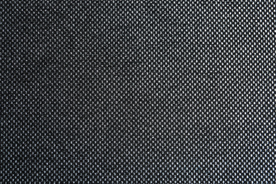 Photo of Texture of dark fabric as background, closeup