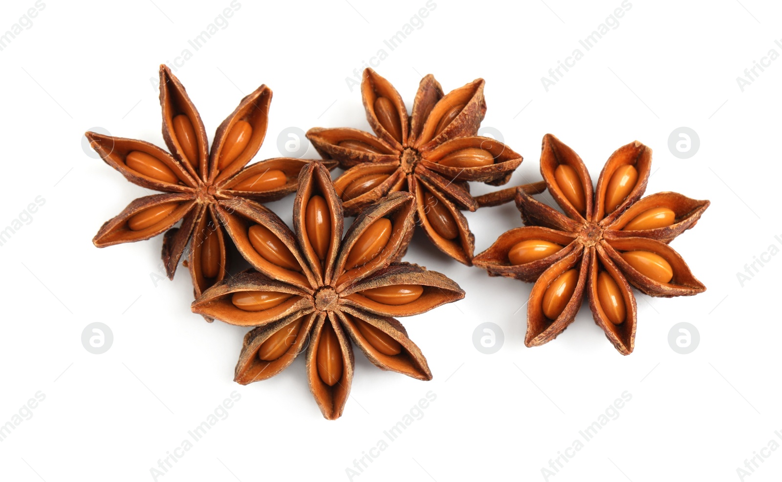 Photo of Dry anise stars with seeds on white background