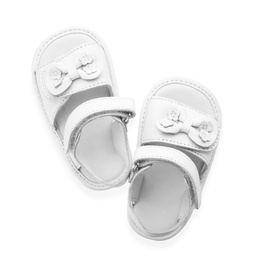 Photo of Pair of cute baby sandals decorated with bows on white background, top view