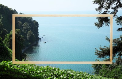 Image of Wooden frame and beautiful sea near mountains