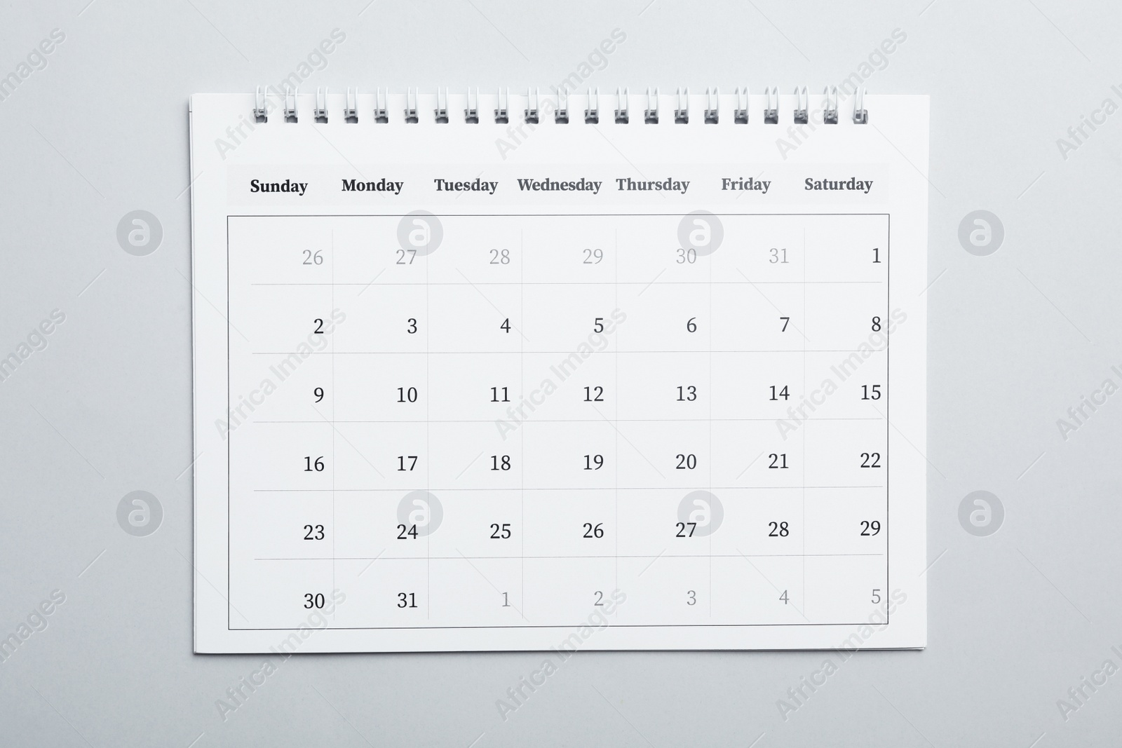 Photo of Paper calendar on light grey background, top view