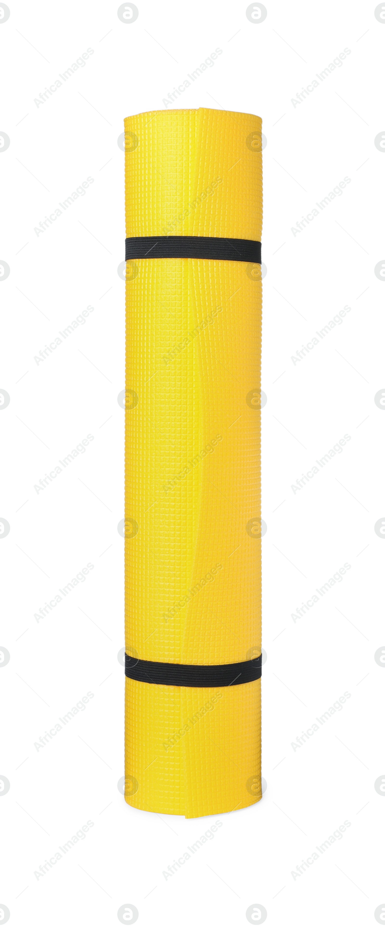 Photo of Yellow rolled mat isolated on white. Camping tourism equipment