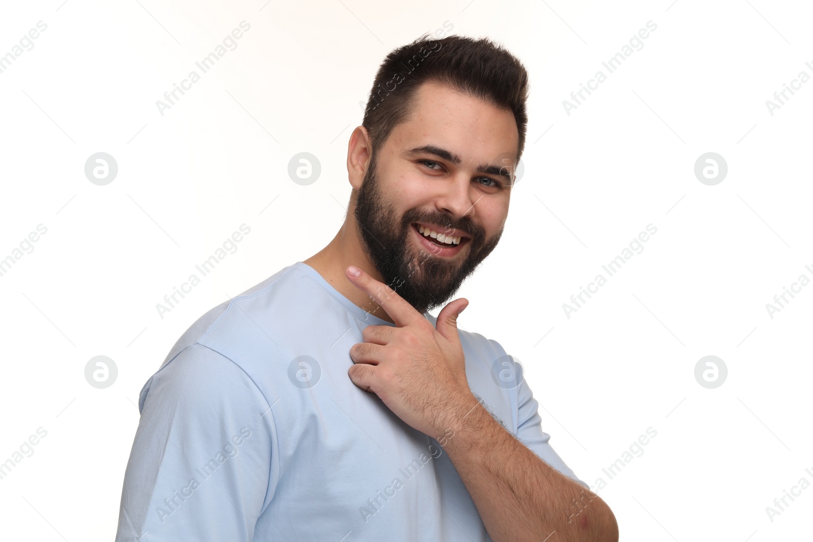 Photo of Man showing his clean teeth and smiling on white background