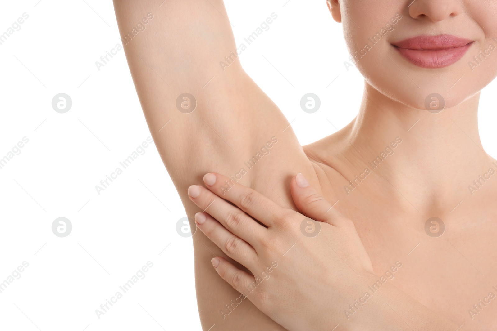 Photo of Young beautiful woman showing armpit with smooth clean skin on white background, closeup