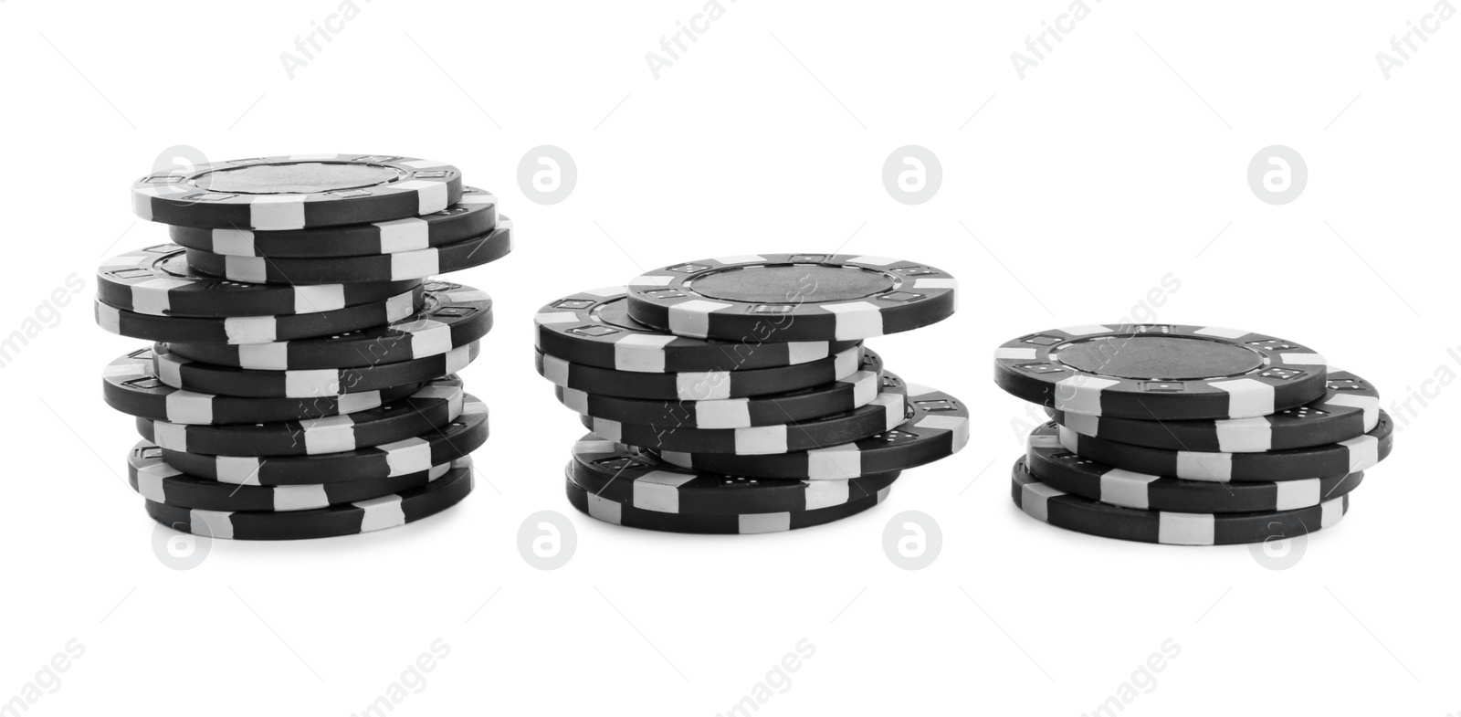 Photo of Stacks of casino poker chips on white background