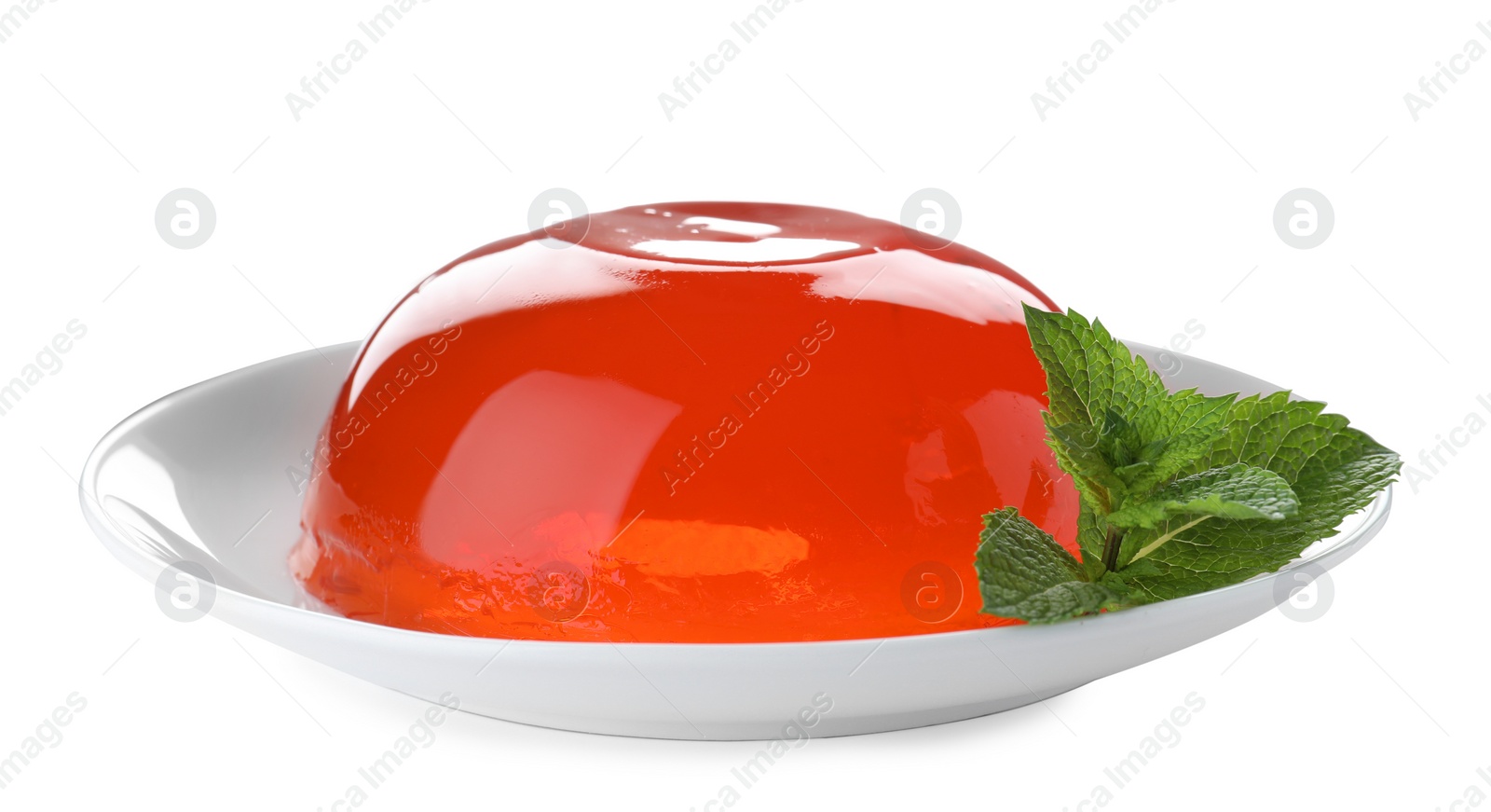 Photo of Delicious orange jelly with mint on white background