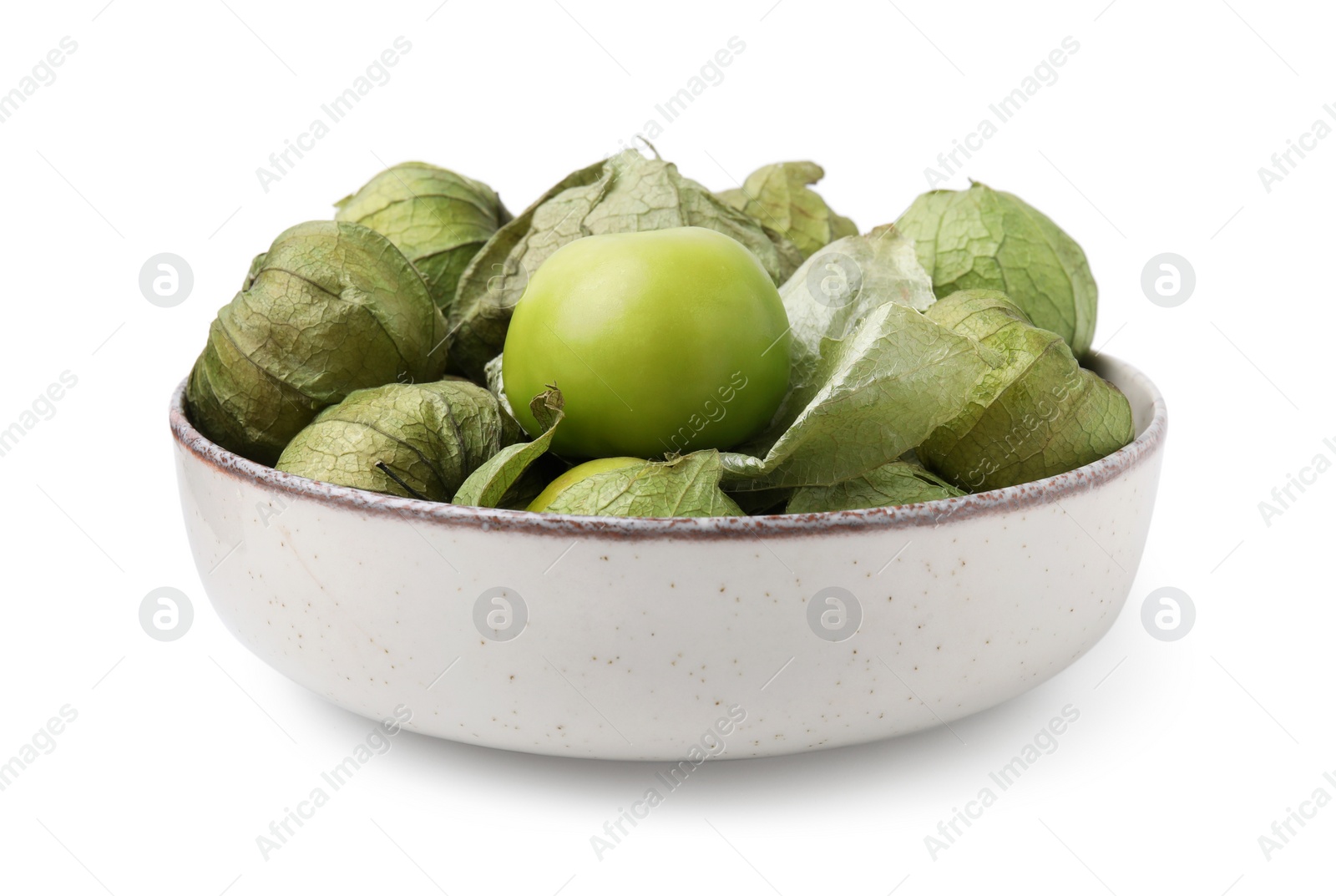 Photo of Bowl of fresh green tomatillos with husk isolated on white