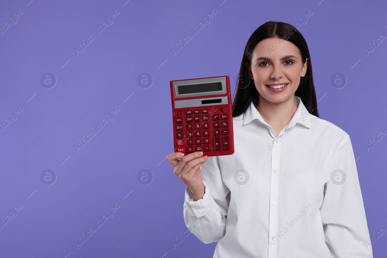 Photo of Smiling accountant with calculator on purple background, space for text