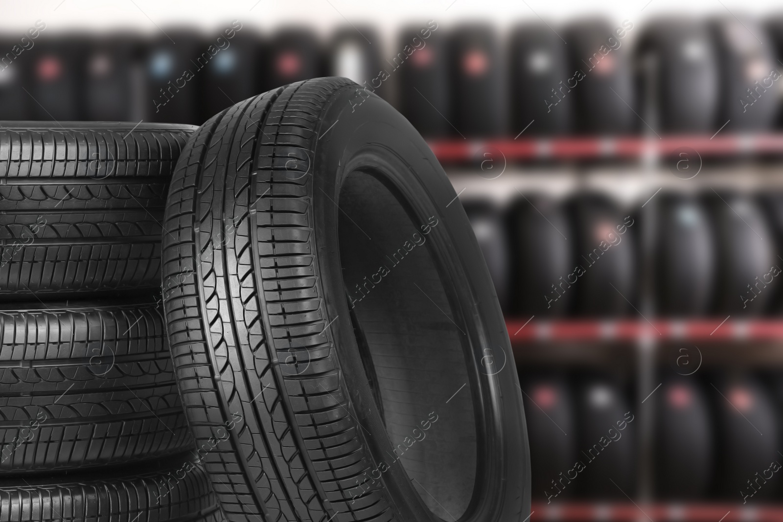 Image of Black car tires in auto store, closeup