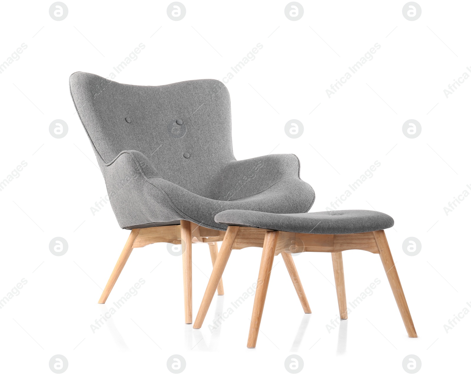 Photo of Comfortable armchair and footstool on white background