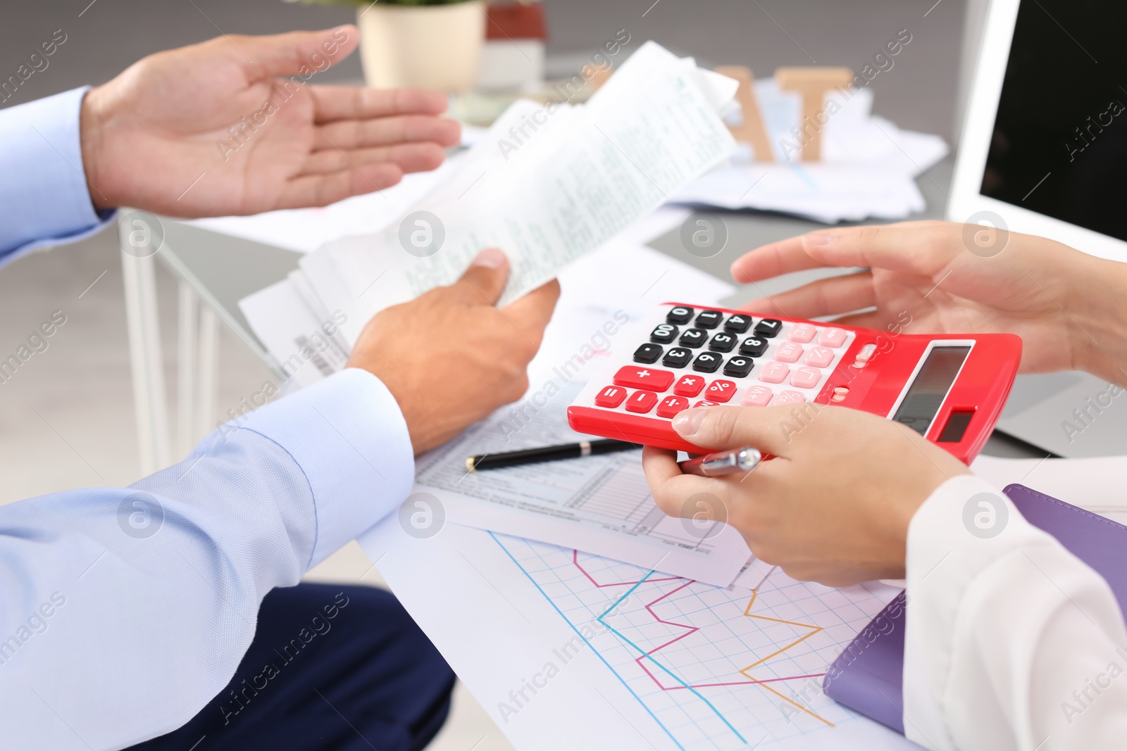 Photo of Tax accountants working with documents at table