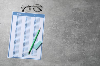 Photo of Answer sheet, pencil and eyeglasses on light grey table, flat lay with space for text. Student passing exam