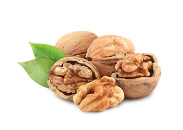 Image of Tasty walnuts and green leaves on white background