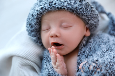 Cute newborn baby sleeping on plaid, top view