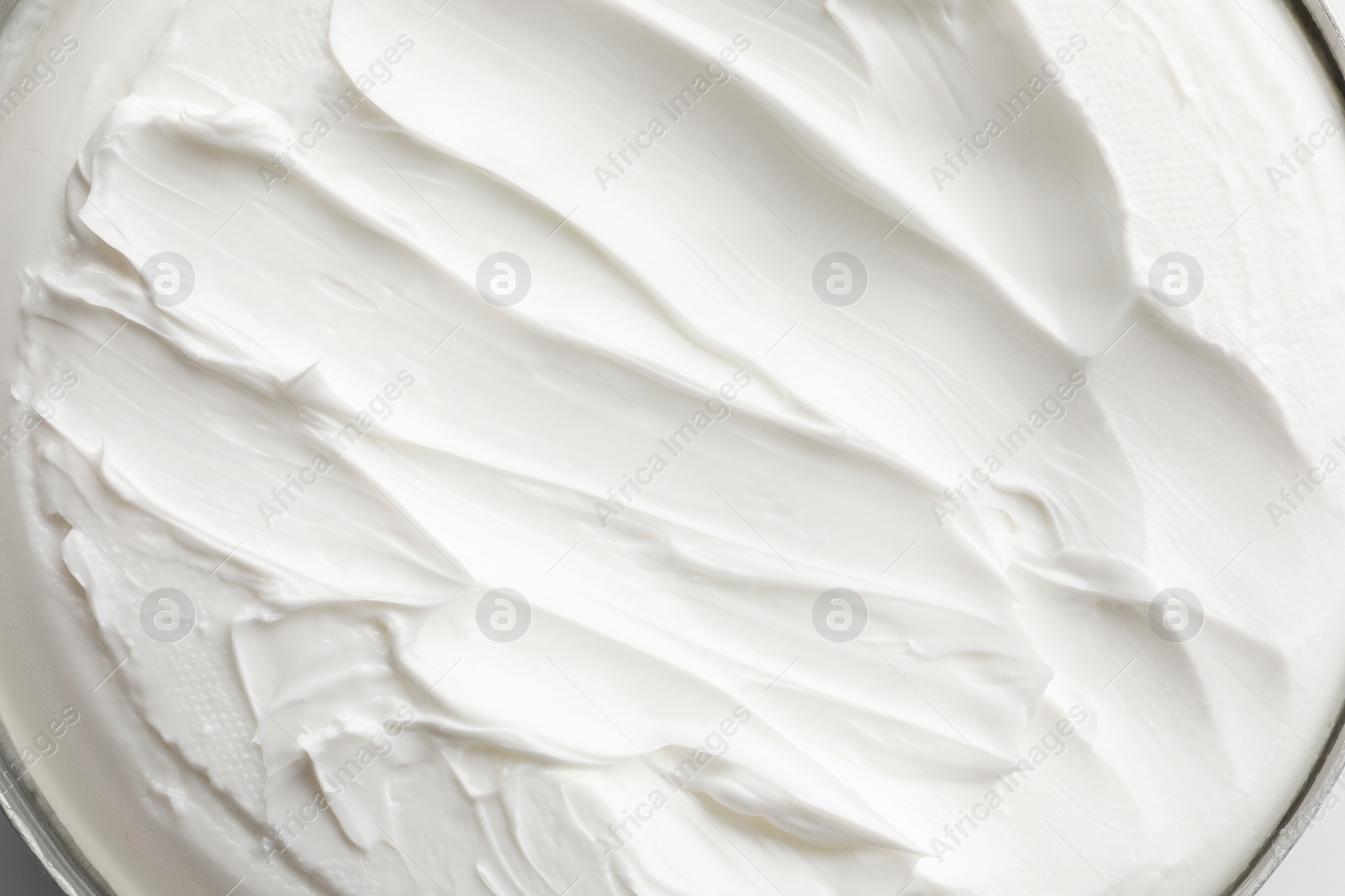 Photo of Texture of white facial cream, top view