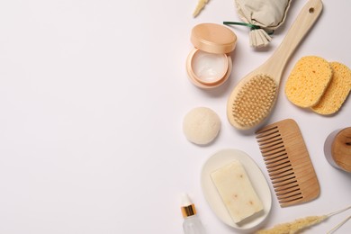 Photo of Bath accessories. Different personal care products and dry spikelets on white background, flat lay with space for text