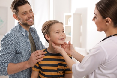 Father with child visiting doctor in hospital