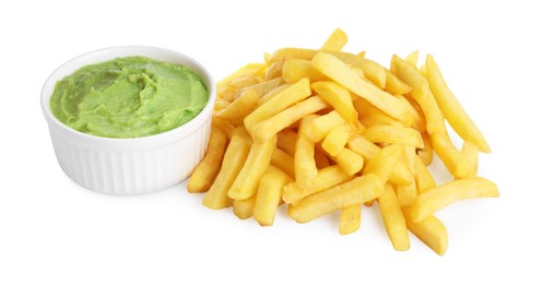 Pile of french fries and dish with avocado dip on white background
