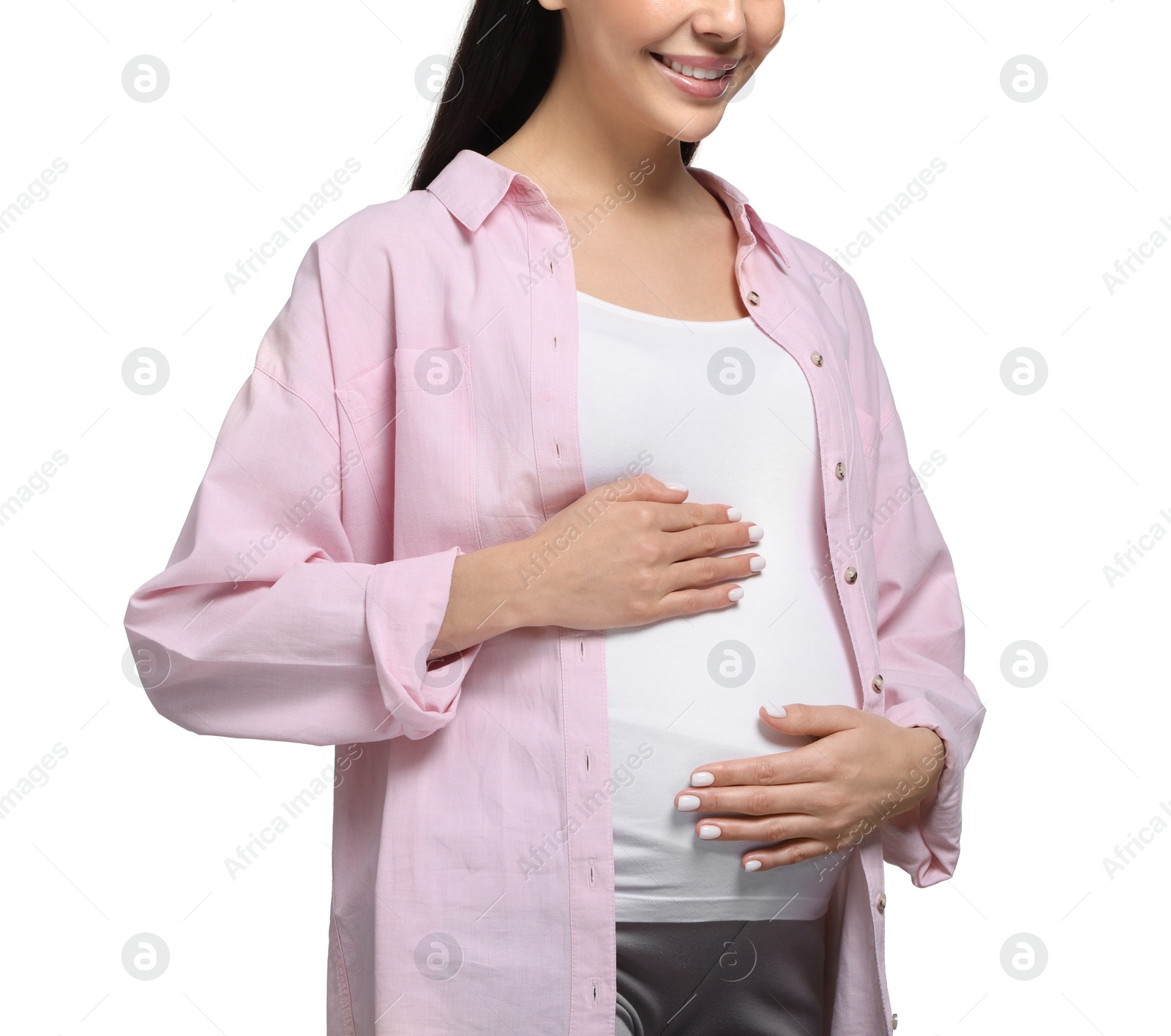 Photo of Pregnant woman touching her belly on white background, closeup