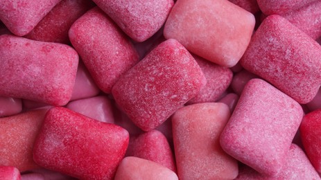 Many pink chewing gums as background, top view