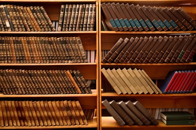 Collection of different books on shelves in library