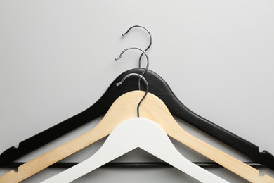 Different hangers on light gray background, top view
