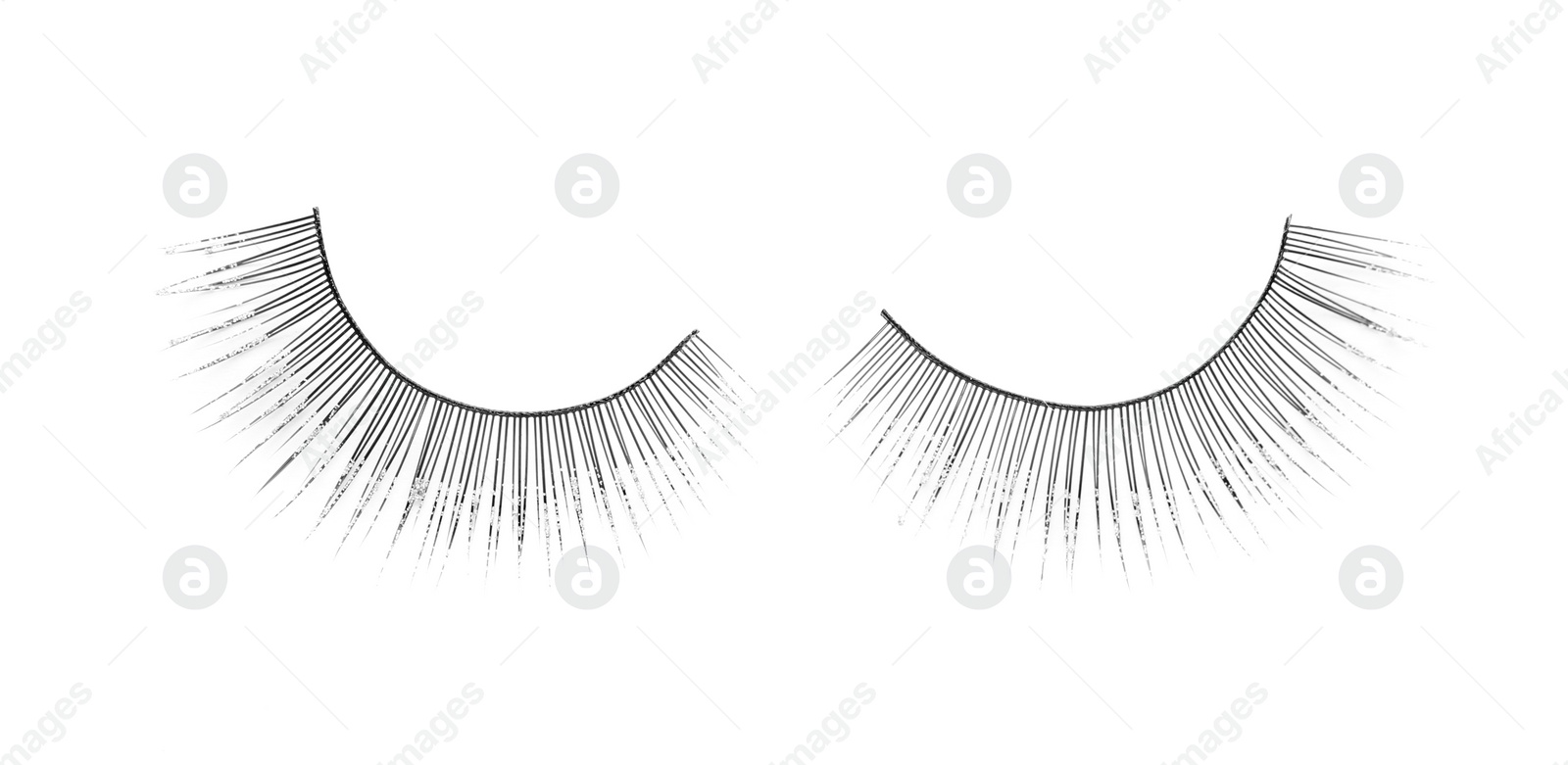 Photo of Fake eyelashes on white background, top view. Makeup product