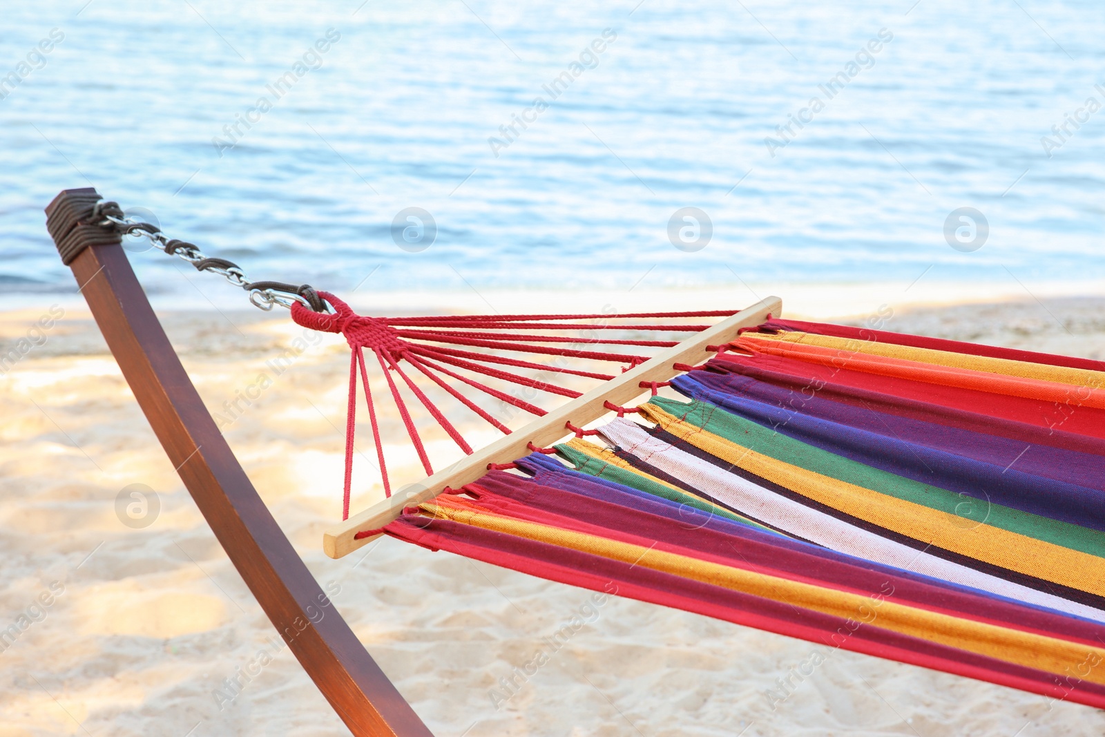 Photo of Colorful hammock at seaside. Time to relax