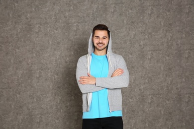 Portrait of handsome man on grey background