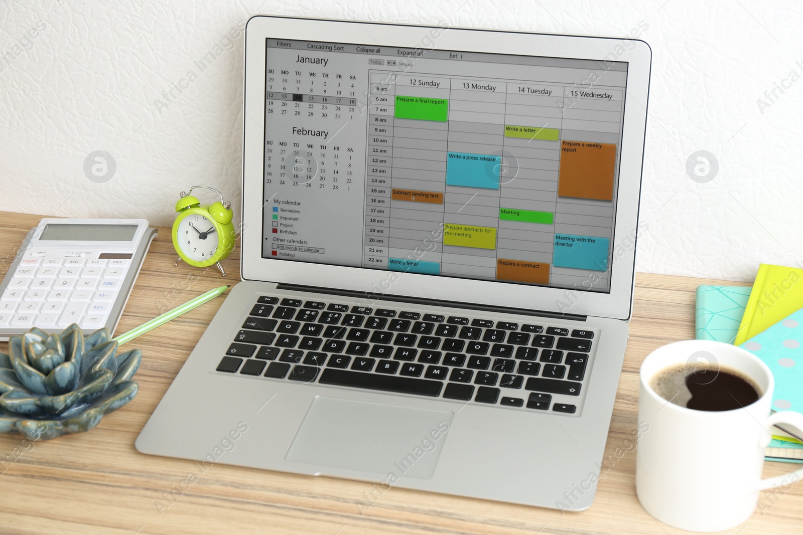 Photo of Modern laptop with calendar app in office