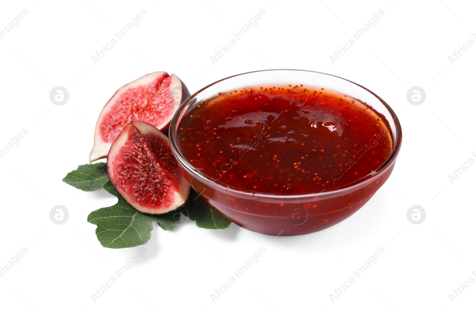 Photo of Bowl with tasty sweet jam, fresh figs and green leaf isolated on white