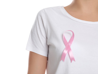 Photo of Woman with pink ribbon on white background, closeup. Breast cancer awareness