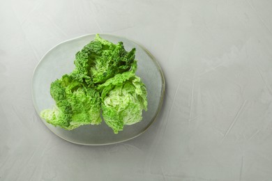 Fresh ripe Chinese cabbages on light grey table, top view. Space for text