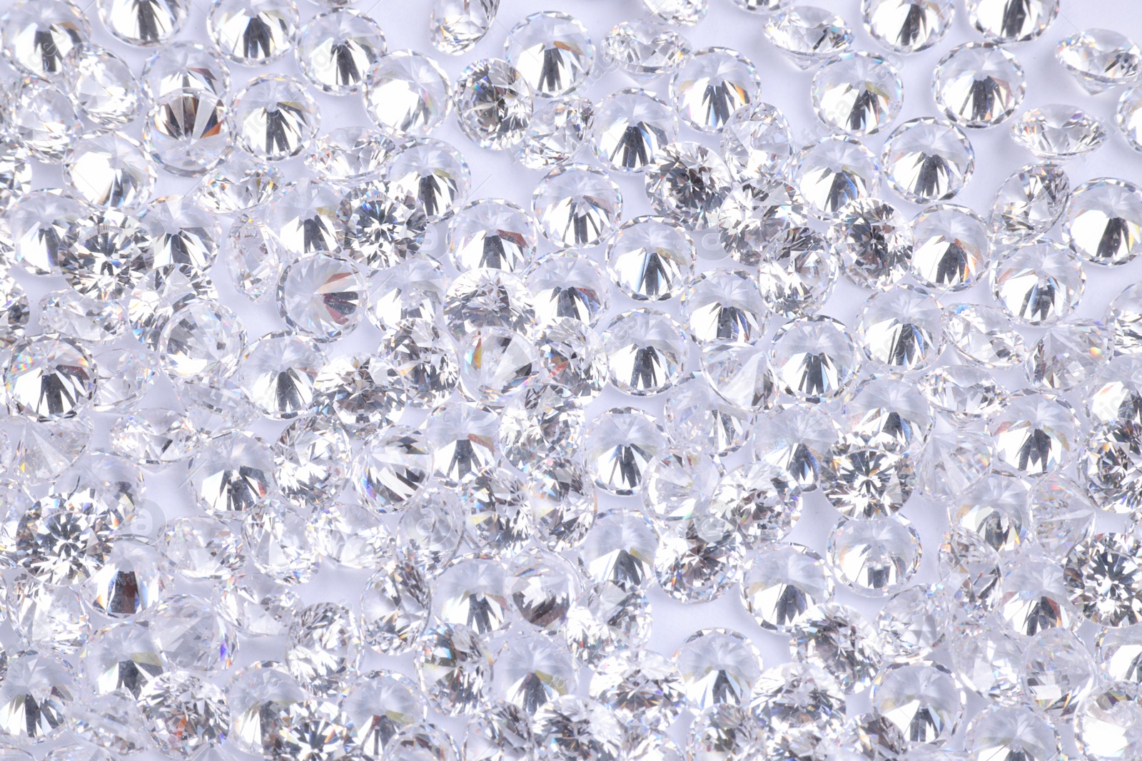 Photo of Many beautiful shiny diamonds as background, above view